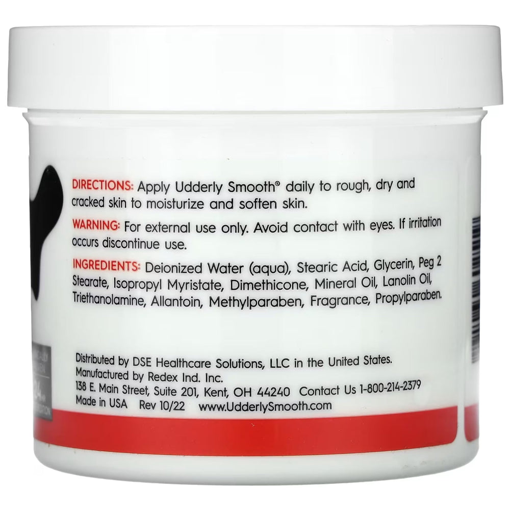 UDDERLY SMOOTH crema corporal, enfoque en manos y brazos, hidratación suave.